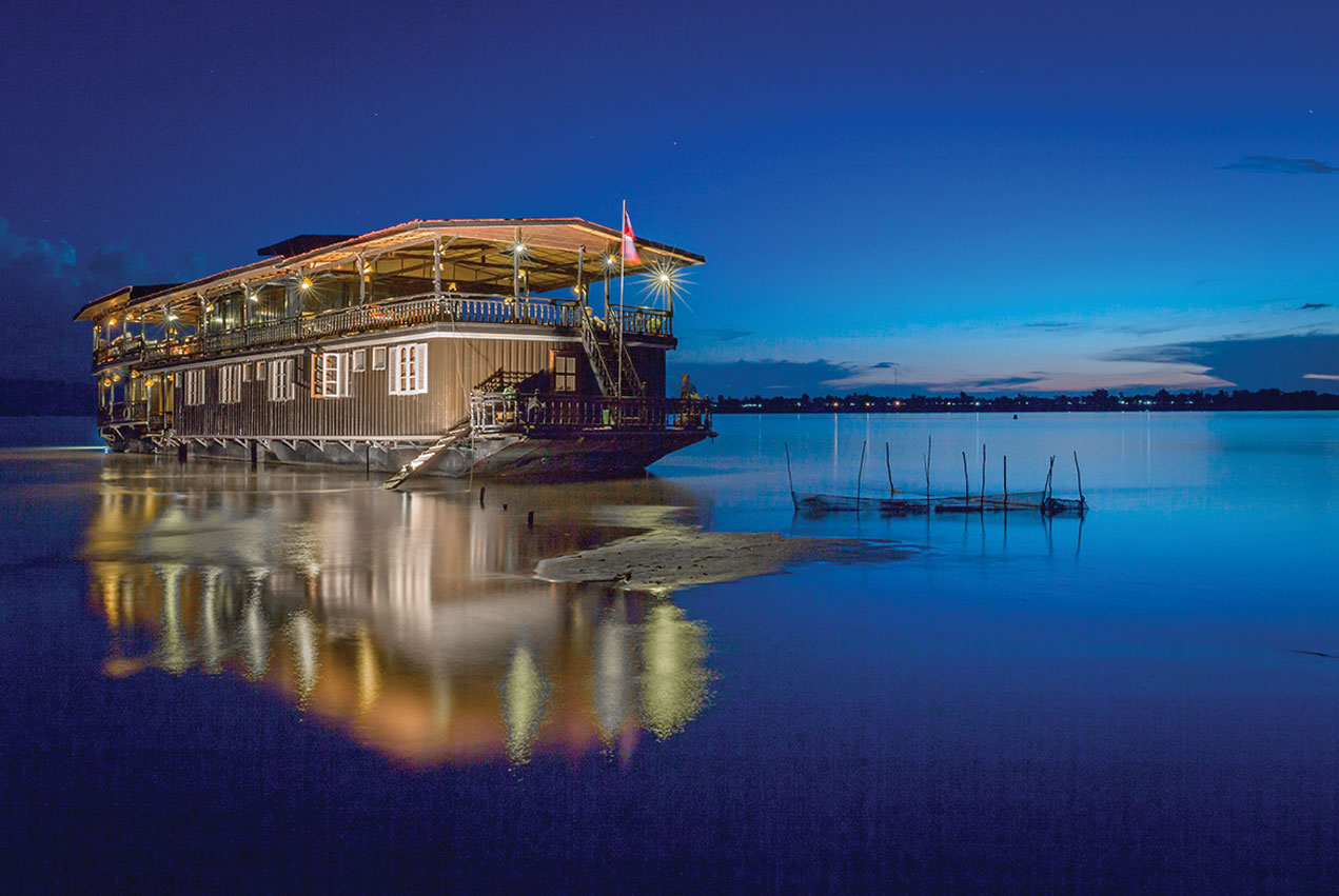 FErry with light in a Loas river at night